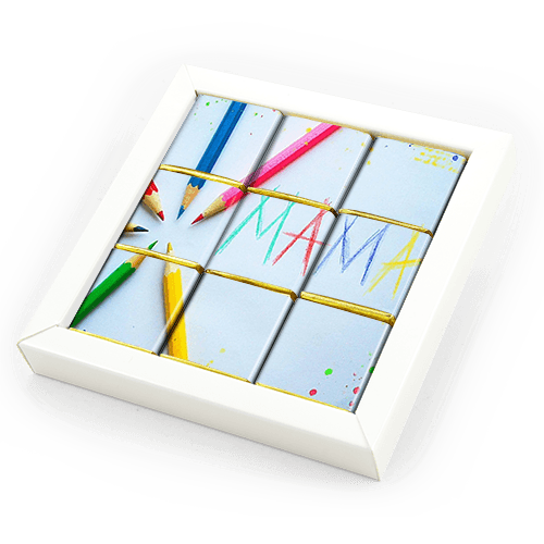 Chocolate set in the frame. Photo or wishing mosaic is placed from chocolates. 
White box.