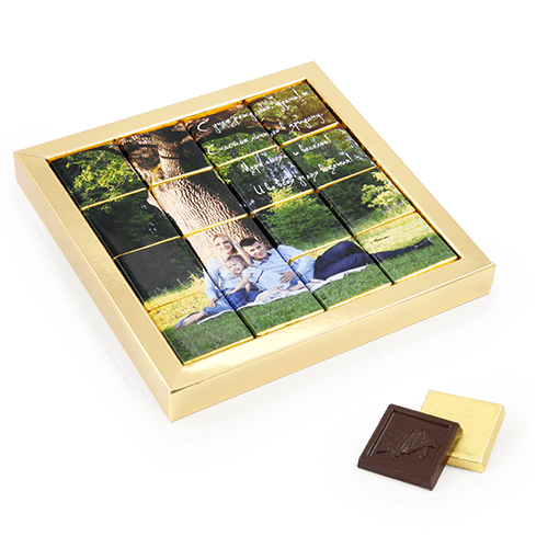 Chocolate set in the frame. Photo or wishing mosaic is placed from chocolates. 
Box white or naturally brown color.