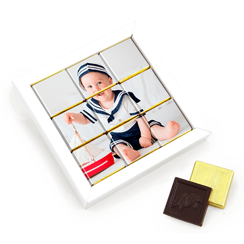 Chocolate set in the frame. Picture of the child or the mosaic with wishes 
collected from chocolates. White box.